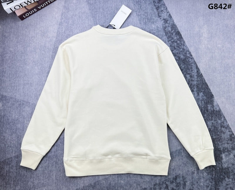 Side profile of Gucci luxury clothing with signature branding