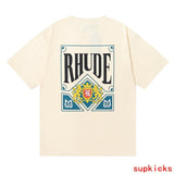 Flat lay presentation of Rhude luxury clothing with monogram-inspired silhouette