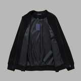 Close-up detail shot of Louis Vuitton luxury clothing with signature branding
