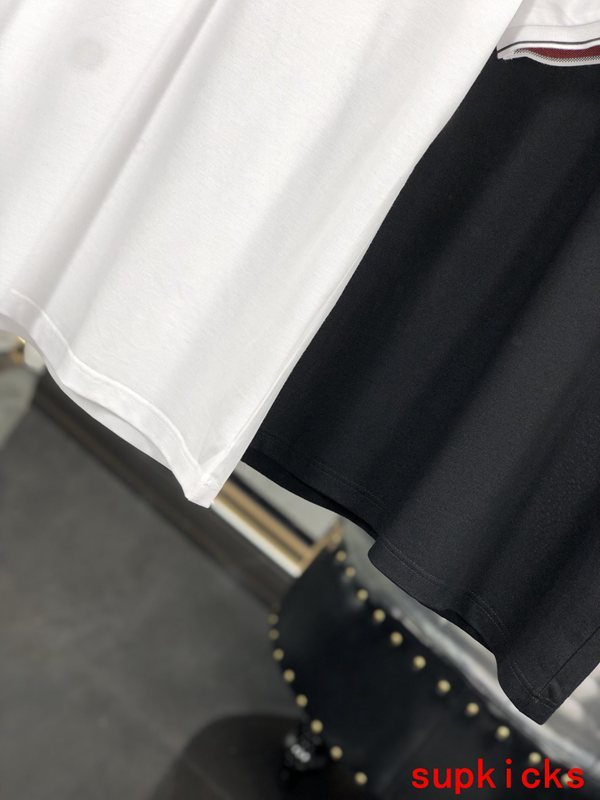 Flat lay presentation of Moncler luxury clothing with tailored silhouette