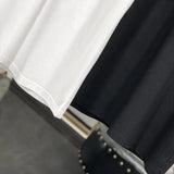 Flat lay presentation of Moncler luxury clothing with tailored silhouette