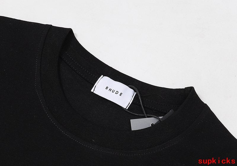 Close-up detail shot of Rhude luxury clothing with monogram-inspired silhouette