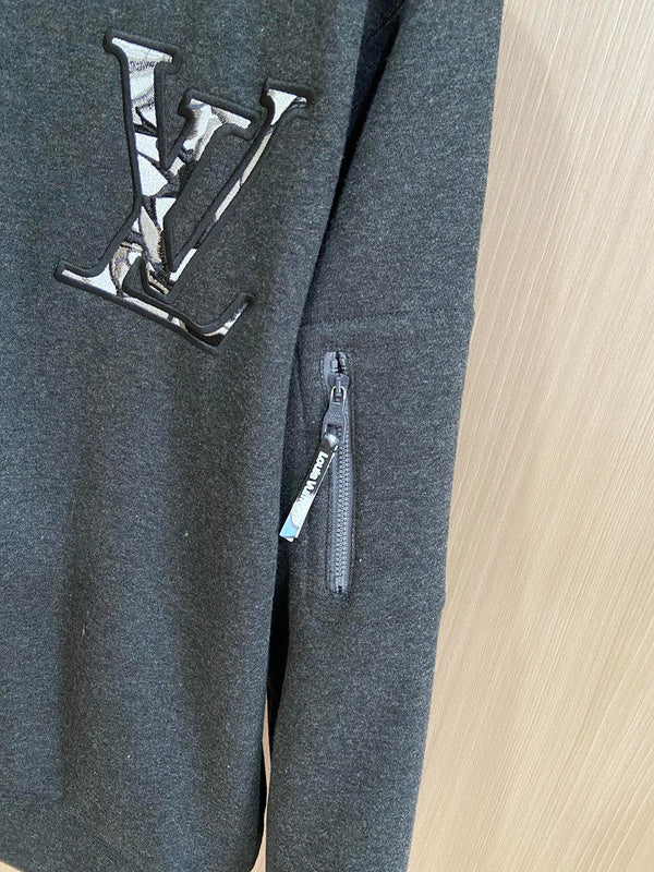 Front view of Louis Vuitton luxury clothing with label-forward styling