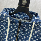 Close-up detail shot of Louis Vuitton luxury clothing with label-forward styling