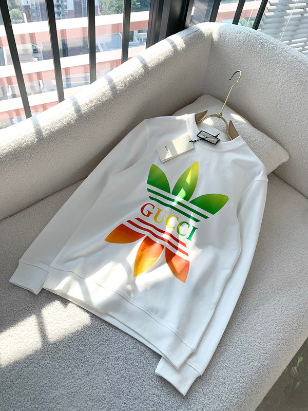 Flat lay presentation of Gucci luxury clothing with monogram-inspired silhouette