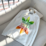 Flat lay presentation of Gucci luxury clothing with monogram-inspired silhouette
