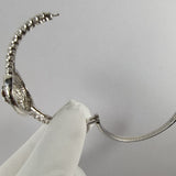 Side view of Cartier unisex jewelry piece