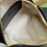 Side profile of structured polished women's handbag – women's luxury accessory