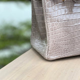 Side view of structured structured handbag