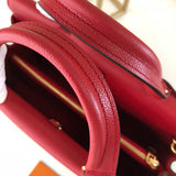 Handle and strap detail of classic elevated women's handbag – women's statement bag