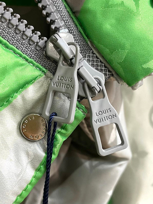 Flat lay presentation of Louis Vuitton luxury clothing with logo-detail design