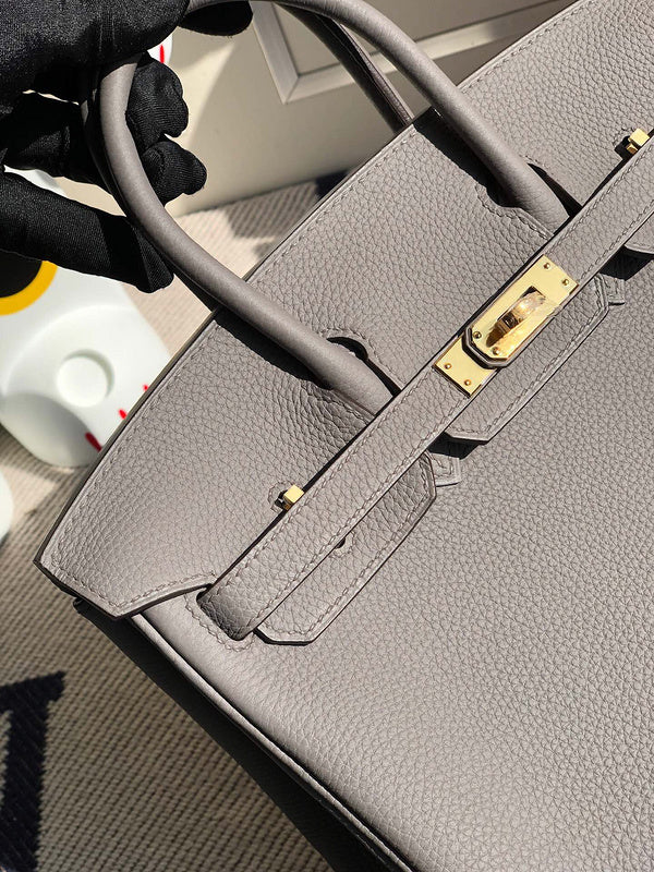 Side view of polished structured handbag