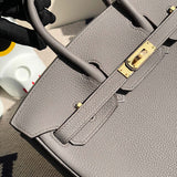 Side view of polished structured handbag