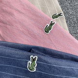 Front view of Lacoste luxury clothing with monogram-inspired silhouette