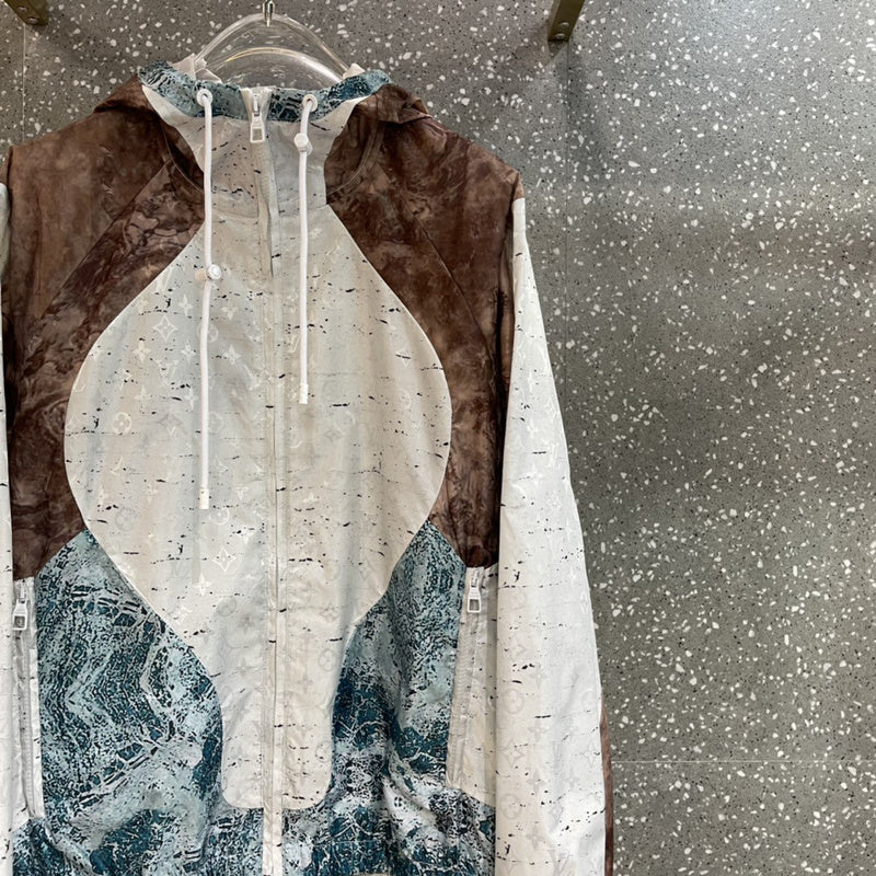 Flat lay presentation of Louis Vuitton luxury clothing with monogram-inspired silhouette