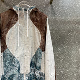 Flat lay presentation of Louis Vuitton luxury clothing with monogram-inspired silhouette