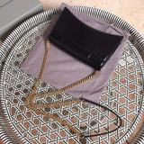 Styled lifestyle shot of signature elevated women's handbag – women's designer-style accessory