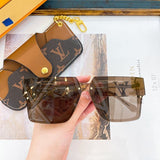 Close-up detail view of Louis Vuitton unisex sunglasses