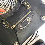 Handle and strap detail of polished elevated women's handbag – women's luxury accessory