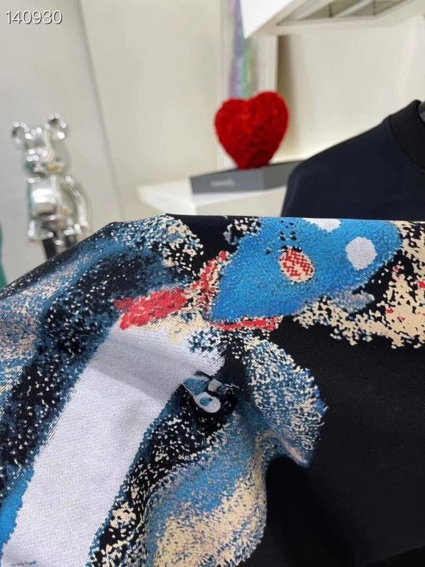 Flat lay presentation of Louis Vuitton luxury clothing with runway-inspired design