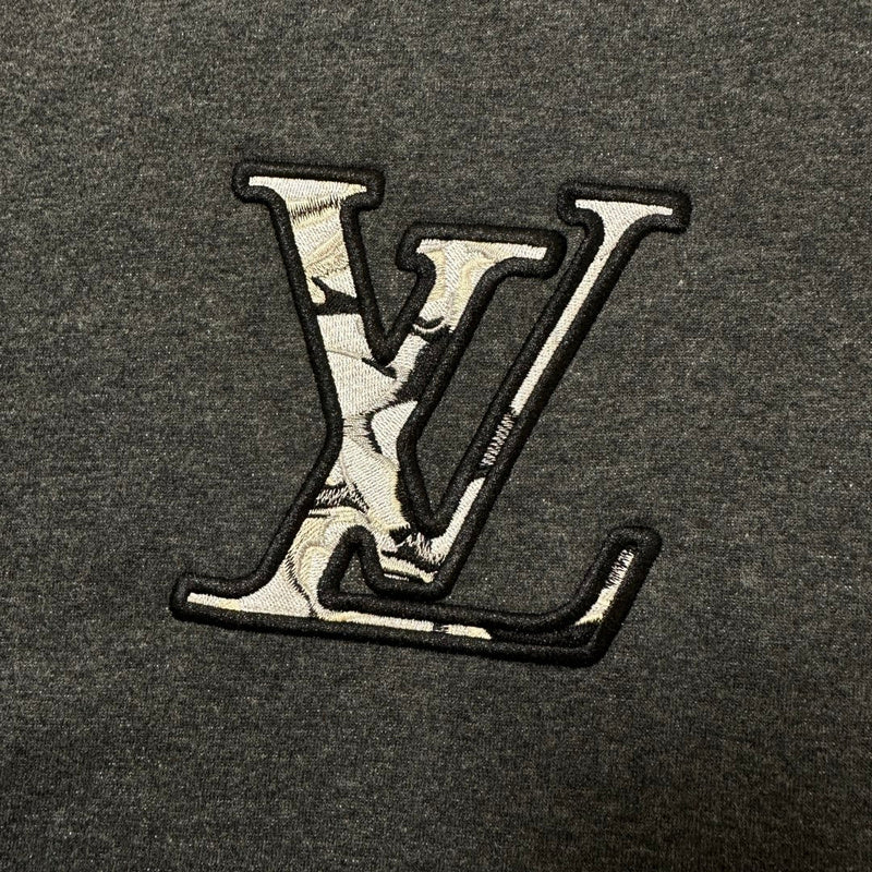 Flat lay presentation of Louis Vuitton luxury clothing with logo-detail design