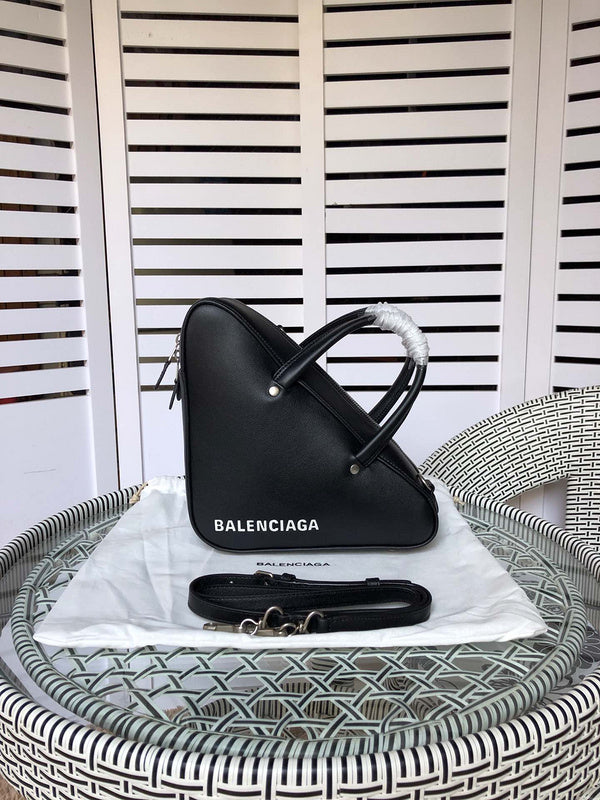 Side profile of refined signature women's handbag – women's luxury handbag