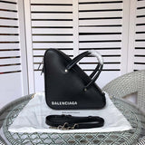 Side profile of refined signature women's handbag – women's luxury handbag