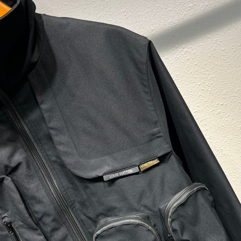 Full styled look of Louis Vuitton luxury clothing with label-forward styling
