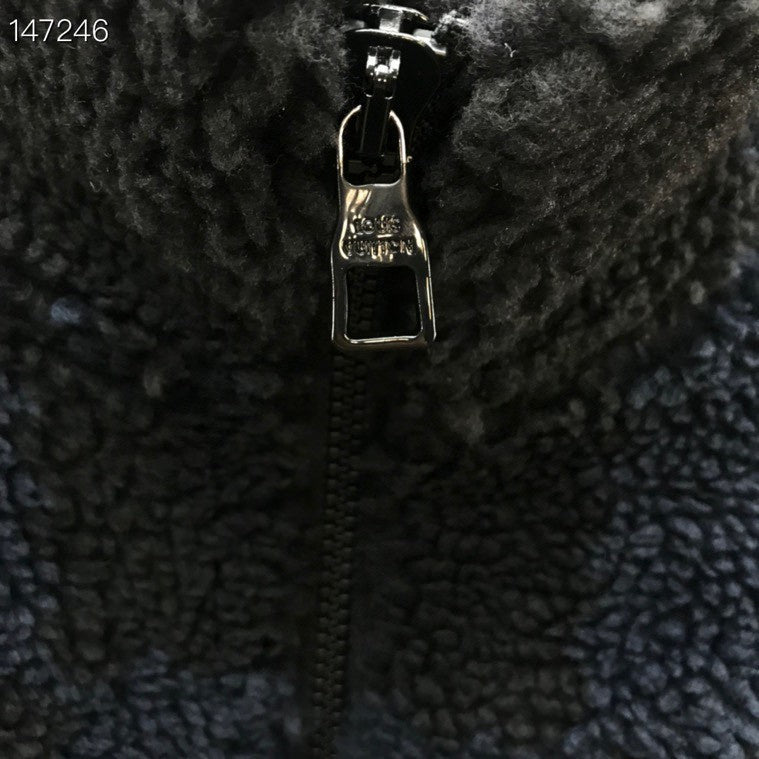 Back view of Louis Vuitton luxury clothing with signature branding