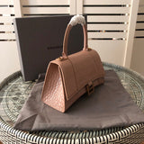 Styled lifestyle shot of classic structured women's handbag – women's statement bag