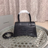 Styled lifestyle shot of refined signature women's handbag – women's designer-style accessory
