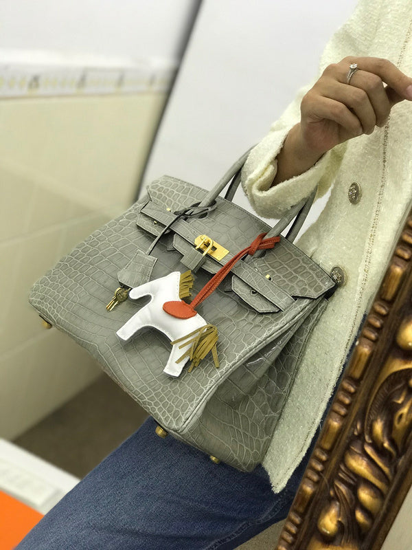 Side view of structured structured handbag