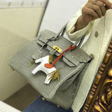 Side view of structured structured handbag