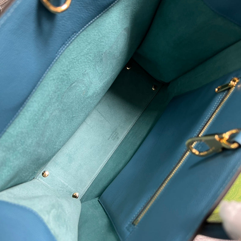 Side profile of premium statement women's handbag – women's luxury accessory