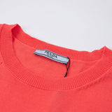 Close-up detail shot of Polo cotton polo shirt with monogram-inspired silhouette