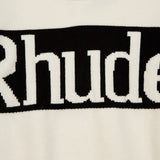 Flat lay presentation of Rhude luxury clothing with signature branding