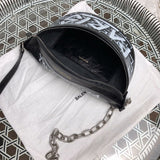 Close-up detail of structured everyday-luxe women's handbag – women's designer-style accessory