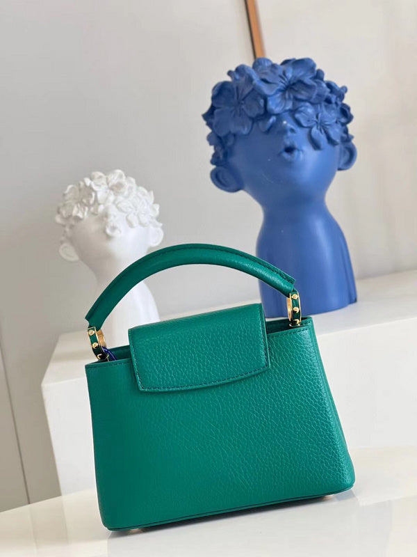 Handle and strap detail of refined chic women's handbag – women's luxury handbag