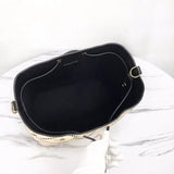 Handle and strap detail of structured refined women's handbag – women's luxury handbag
