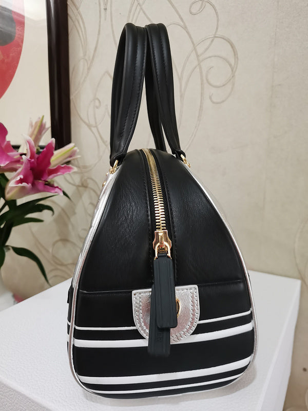 Handle and strap detail of polished structured women's handbag – women's everyday handbag