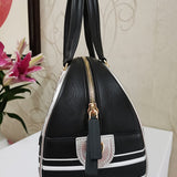 Handle and strap detail of polished structured women's handbag – women's everyday handbag
