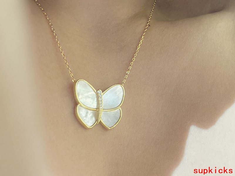 Lifestyle view of Van Cleef & Arpels unisex jewelry piece