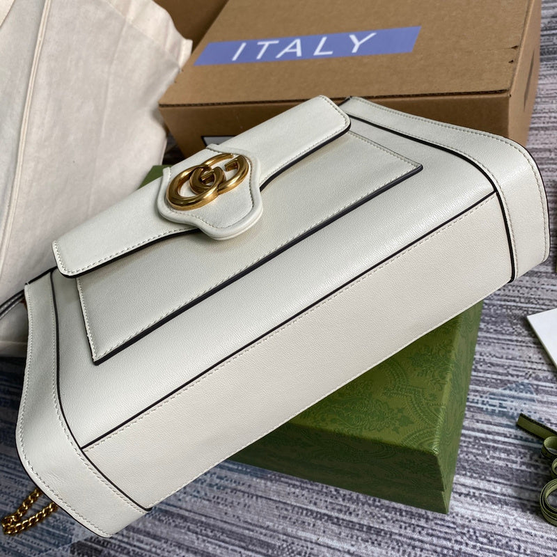 Handle and strap detail of structured polished women's handbag – women's everyday handbag