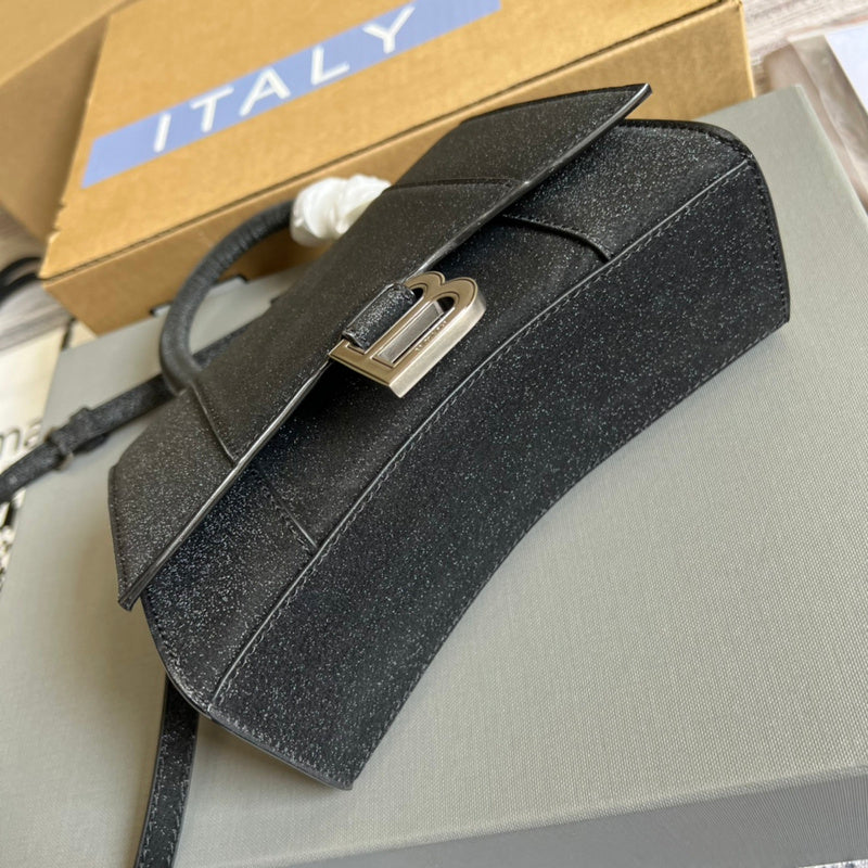 Styled lifestyle shot of sleek modern women's handbag – women's luxury handbag