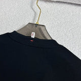 Side profile of Moncler luxury clothing with monogram-inspired silhouette