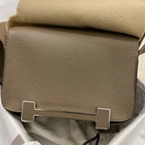 Side view of sculpted structured handbag