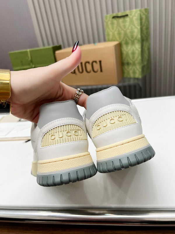 Side profile of Gucci crisp white sneakers retro runner design