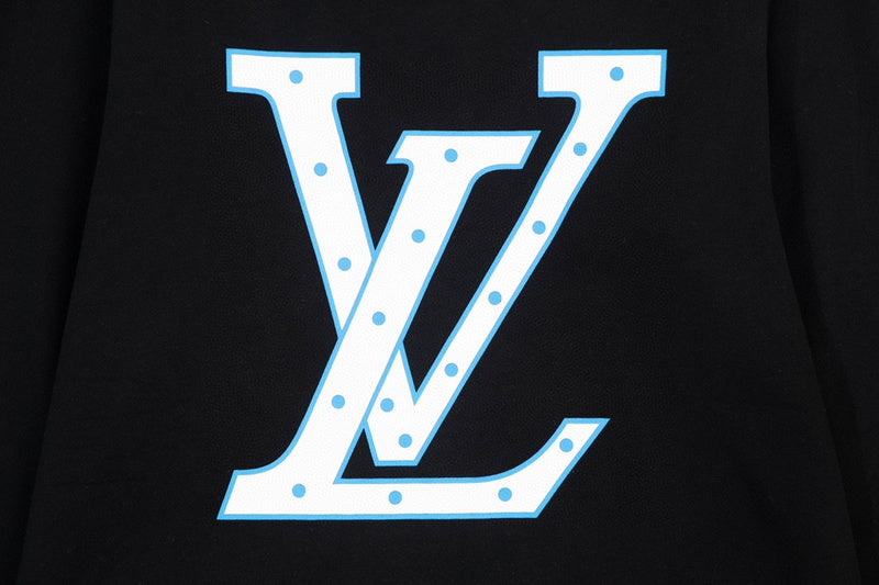 Close-up detail shot of Louis Vuitton luxury clothing with signature branding