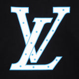 Close-up detail shot of Louis Vuitton luxury clothing with signature branding