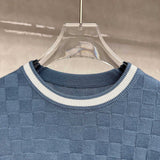 Full styled look of Louis Vuitton luxury clothing with signature branding